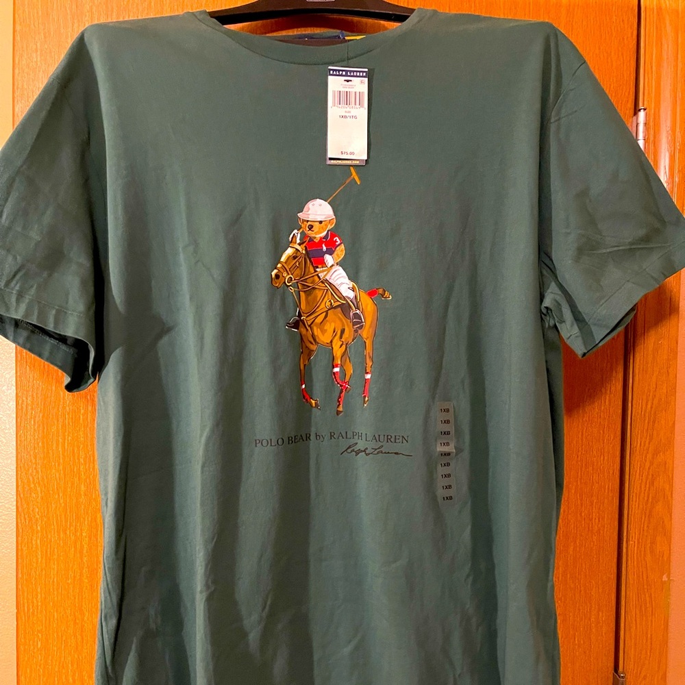 A green polo shirt with the bear on a horse. The size is XL with tags attached.